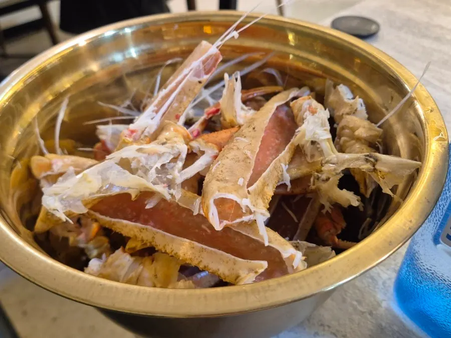 Snow crab being kept warm on an induction burner