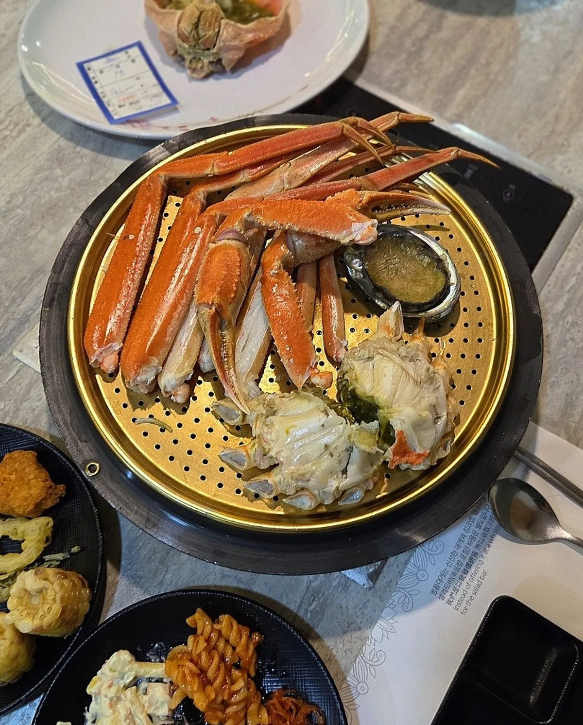 Vertical shot of steamed crab on a plate