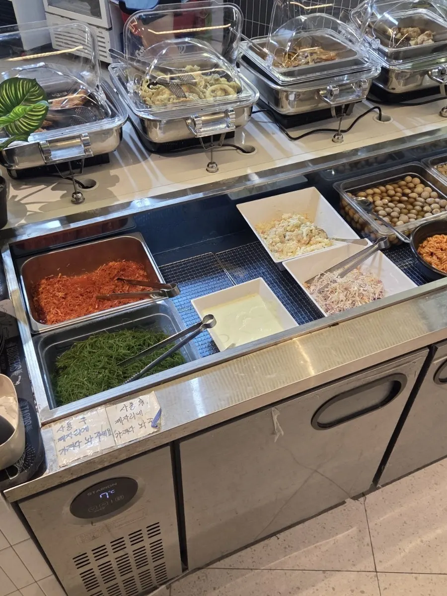 Salad and kimchi corner at the self-serve bar