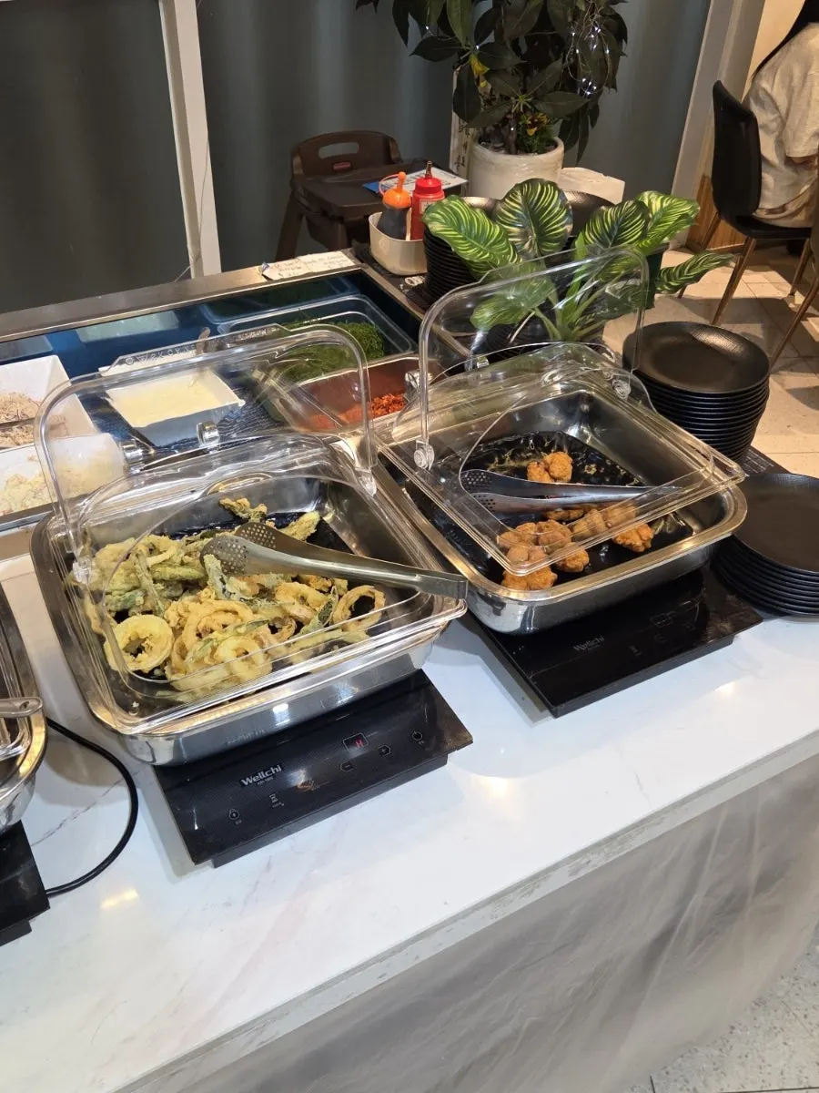 A plate of side dishes gathered from the self-serve bar