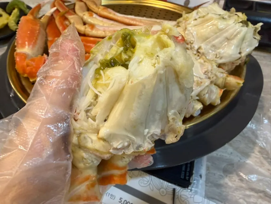 Family eating snow crab together