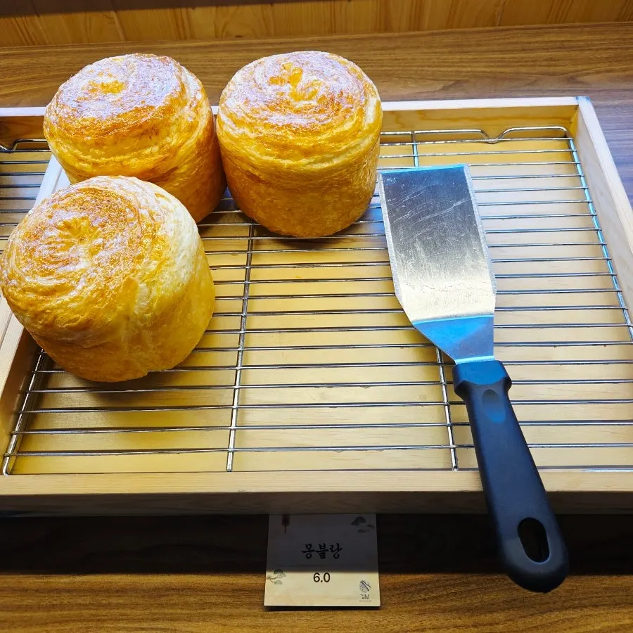 Bakery corner being restocked with bread