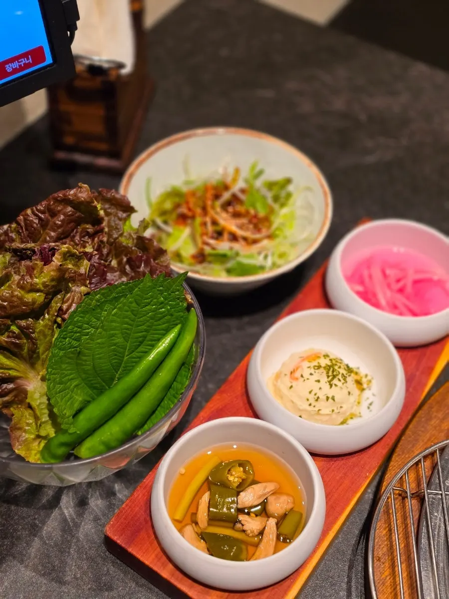 Basic side dishes including lettuce wraps, baek-kimchi, and scallion salad
