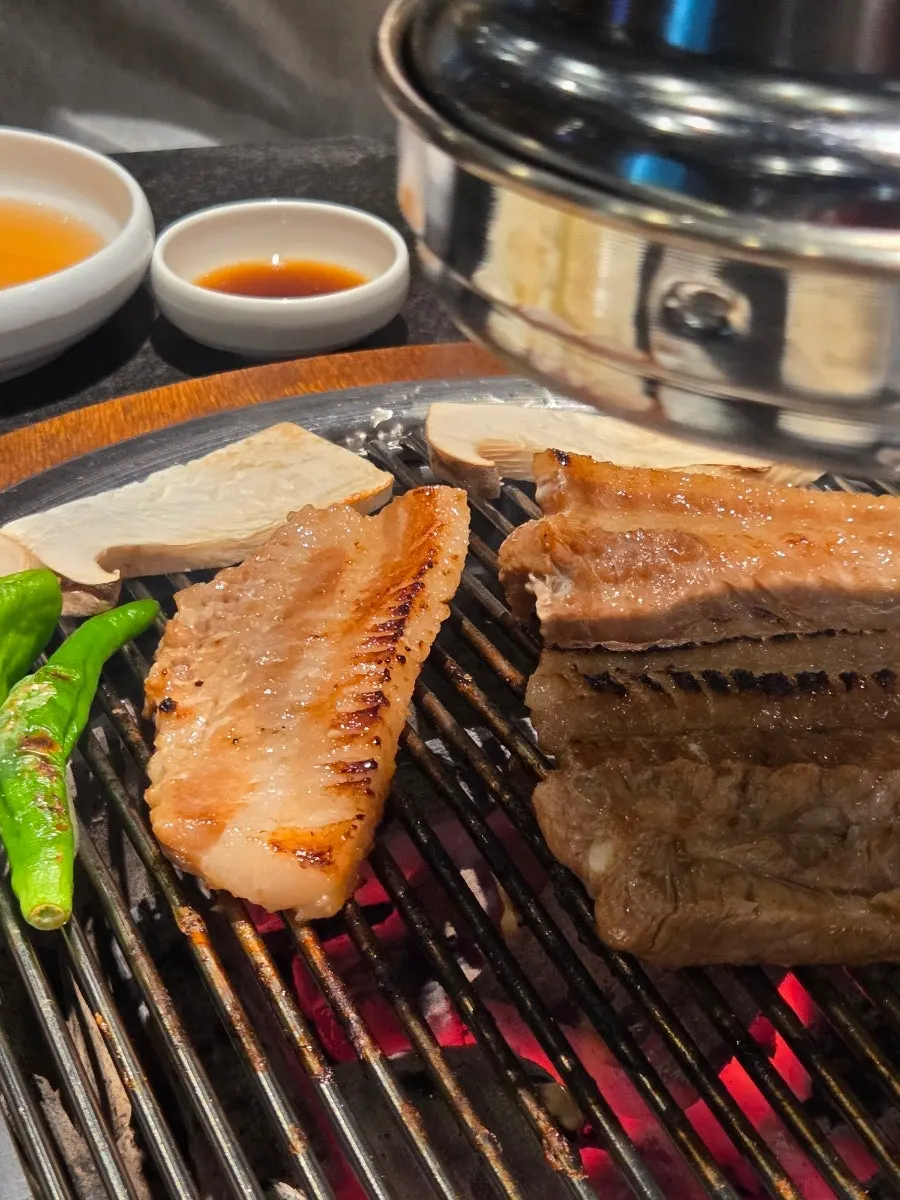 Close-up of marinated ribs grilling