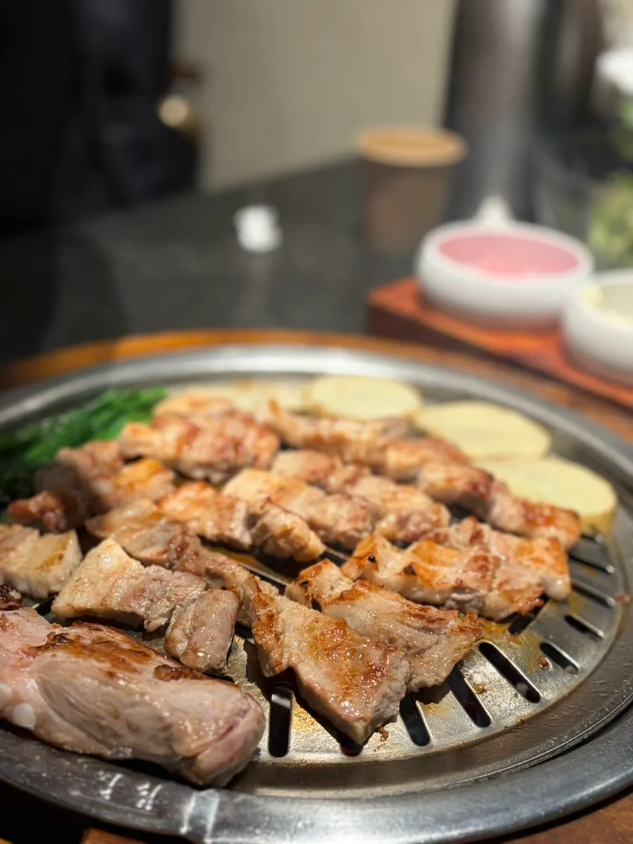 Fresh pork ribs placed on the charcoal grill