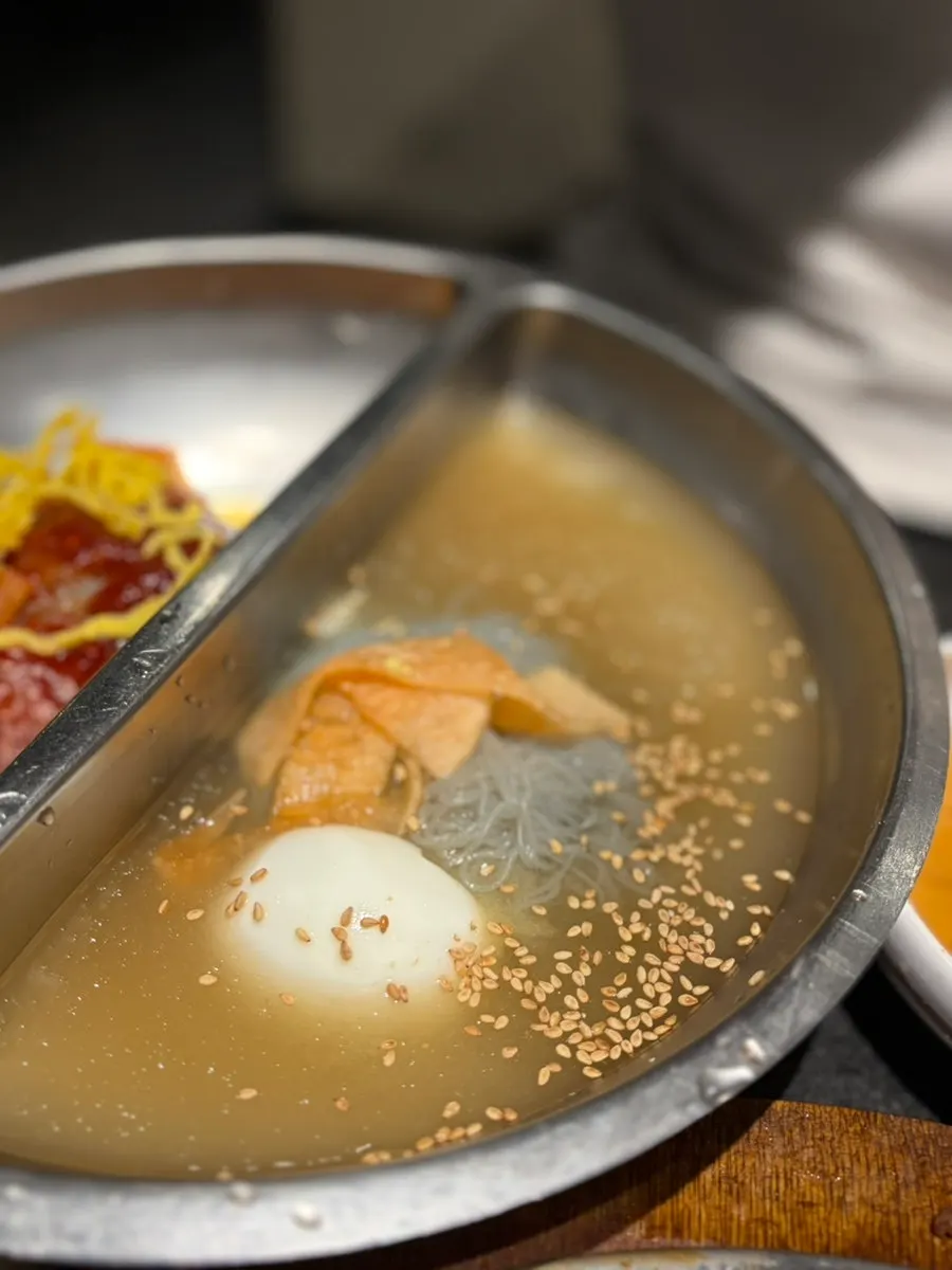 Bibim naengmyeon topped with rib meat, yuksam-naengmyeon style