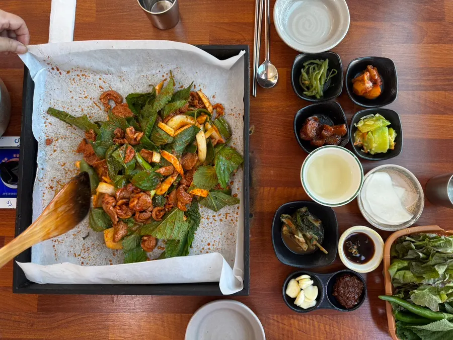 Duck jumulleok on the hot plate piled with perilla leaves