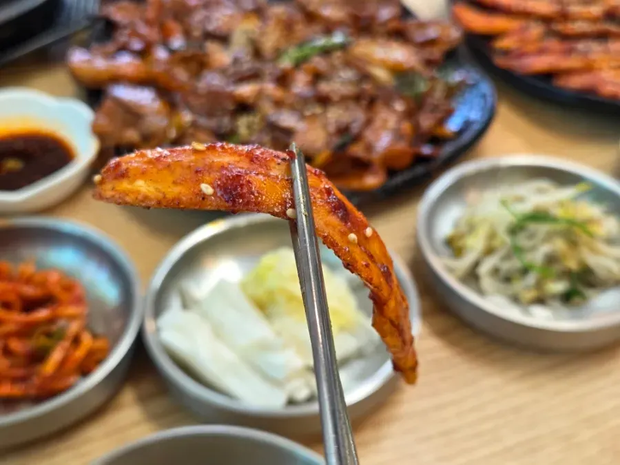 A full plate of sauce-coated grilled deodeok