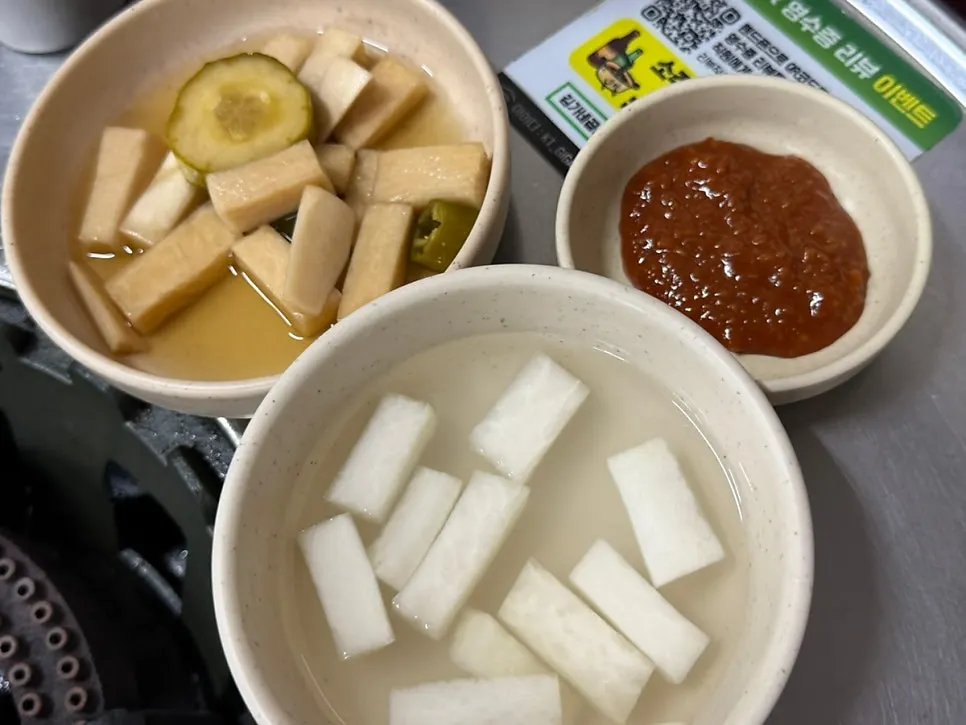 Table with dongchimi and other side dishes