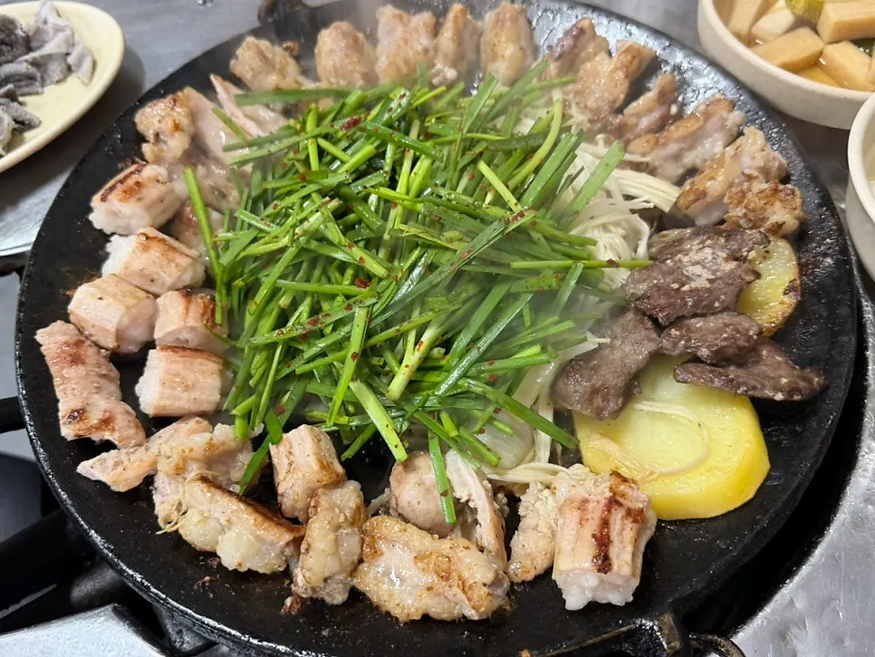 Gopchang dipped into the house special sauce