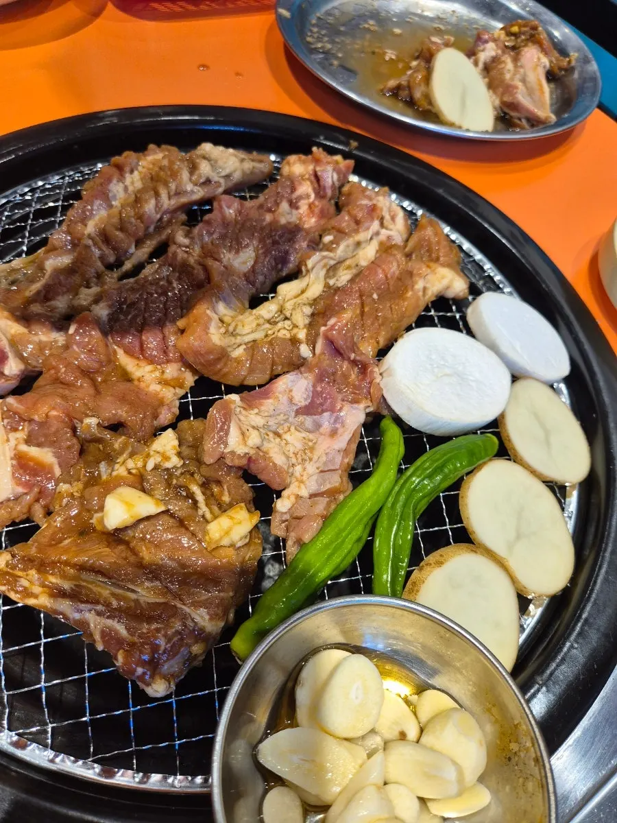 Close-up of marinated ribs turning golden