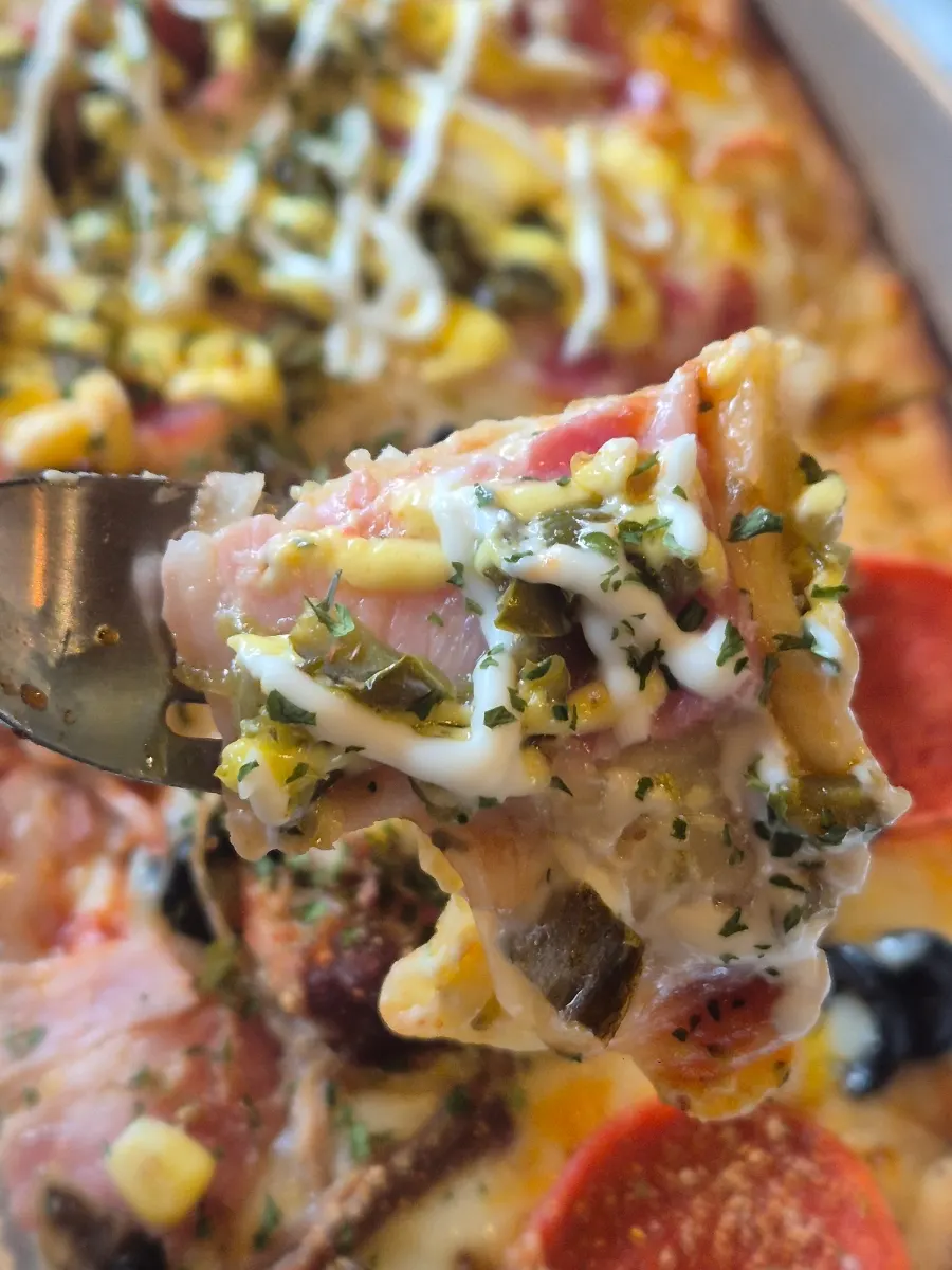 A slice of the combination pizza