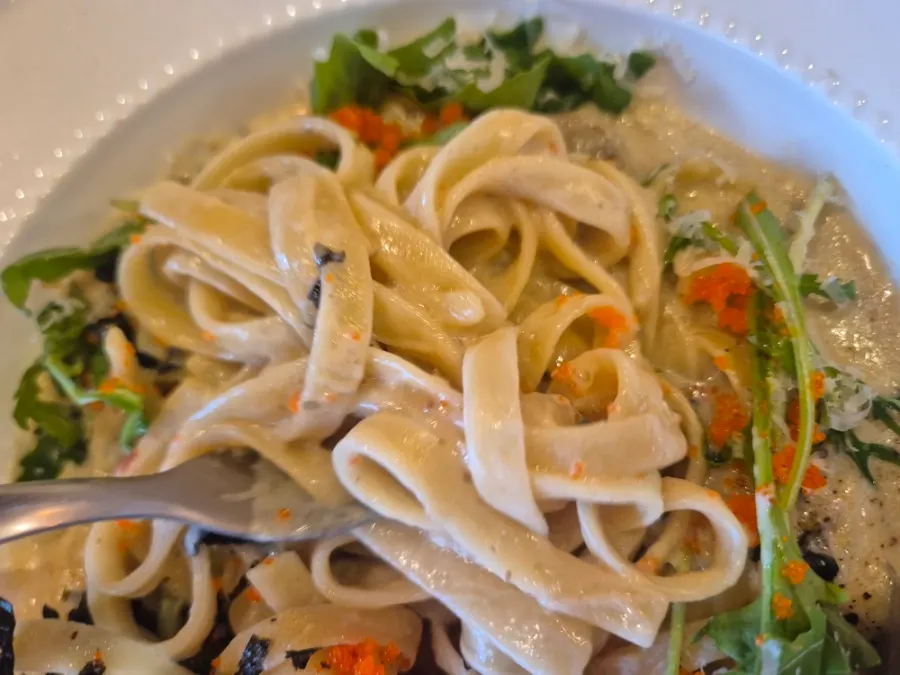Wide noodles coated in snow crab guts cream sauce