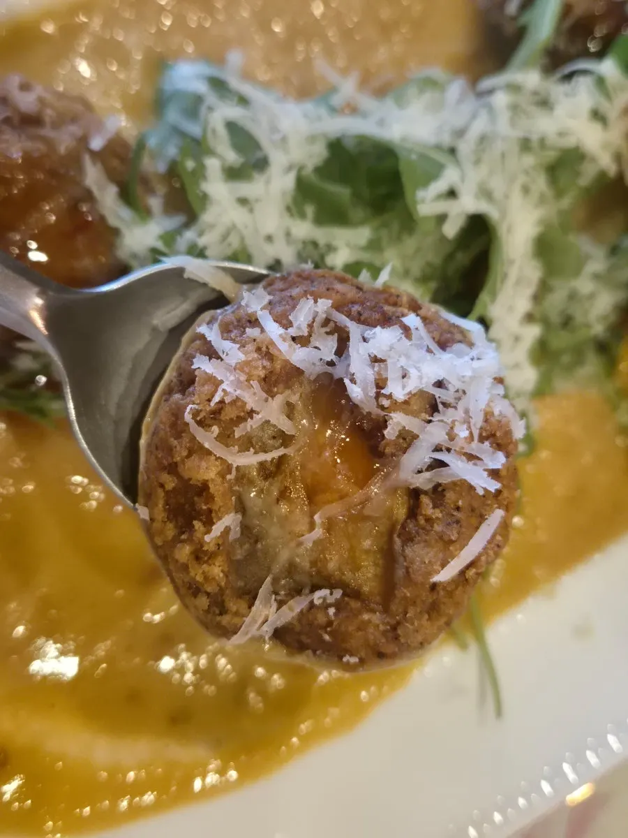 Mushroom shrimp fritter cut in half showing the filling