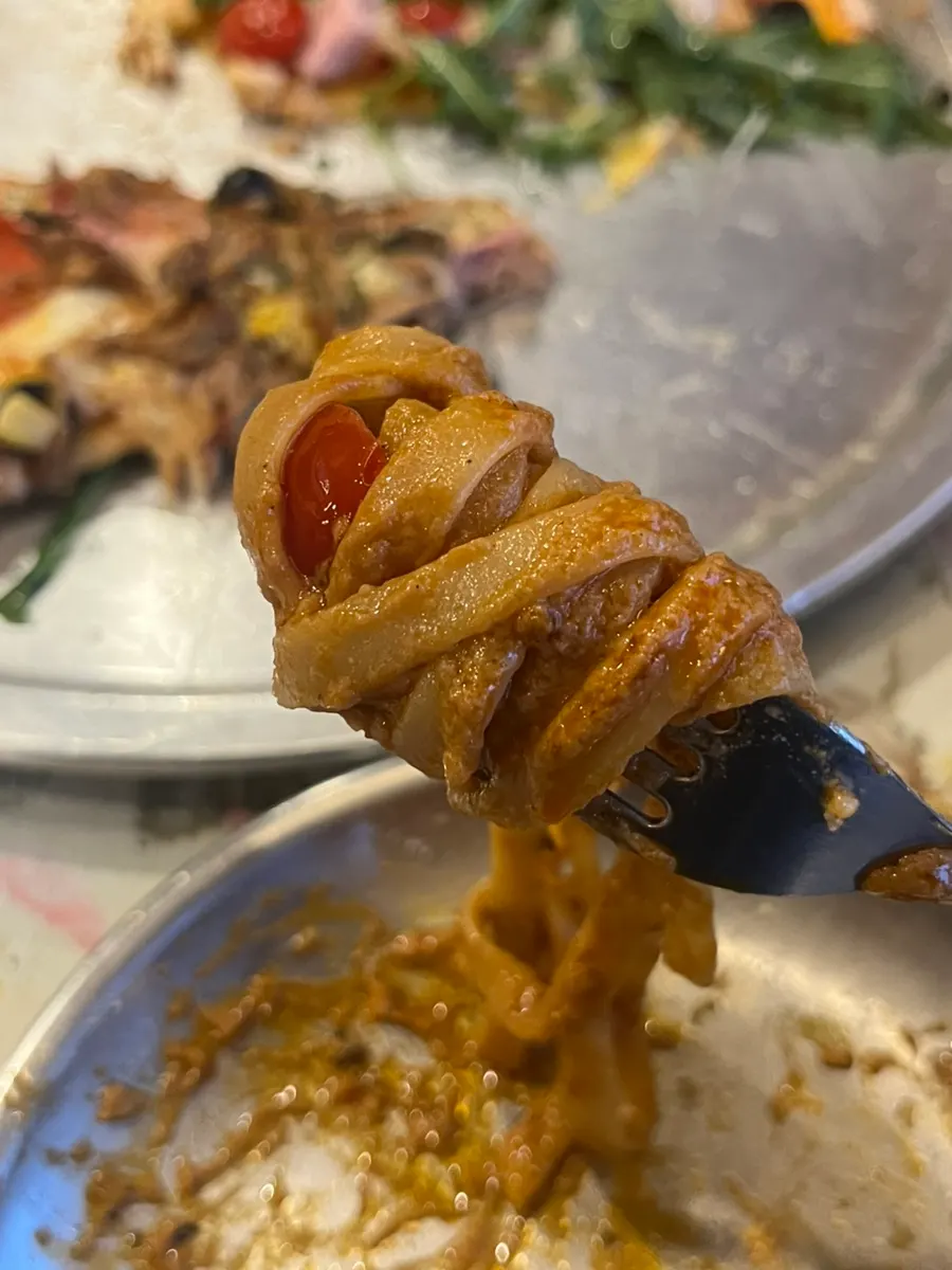 Thick bisque pasta noodles twirled on a fork