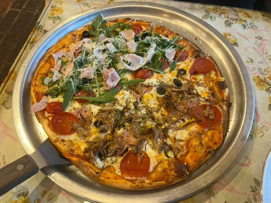 Freshly baked large half-and-half pizza