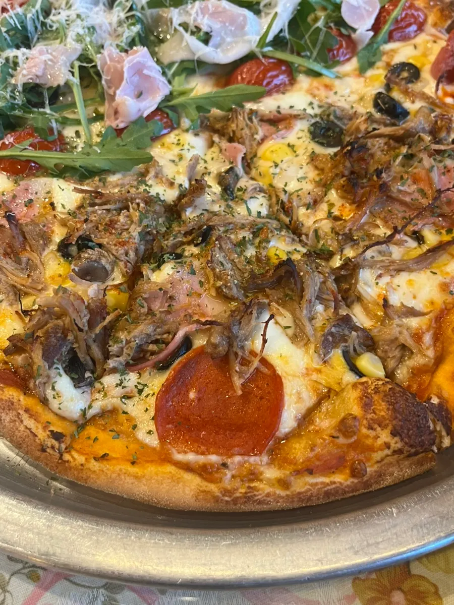 Half of the pizza with Jeongmiso combination toppings