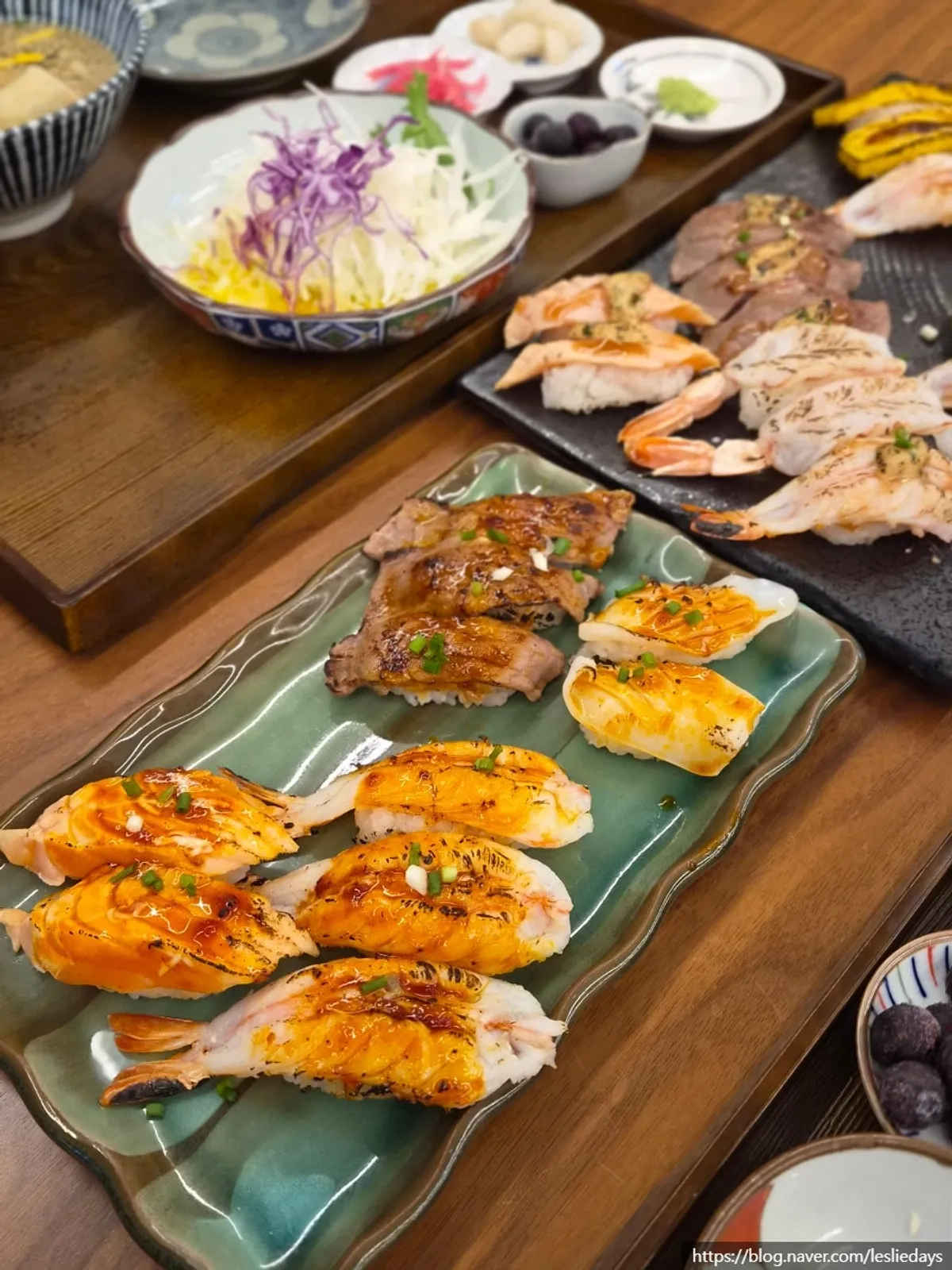 A plate holding 27 pieces of flame sushi
