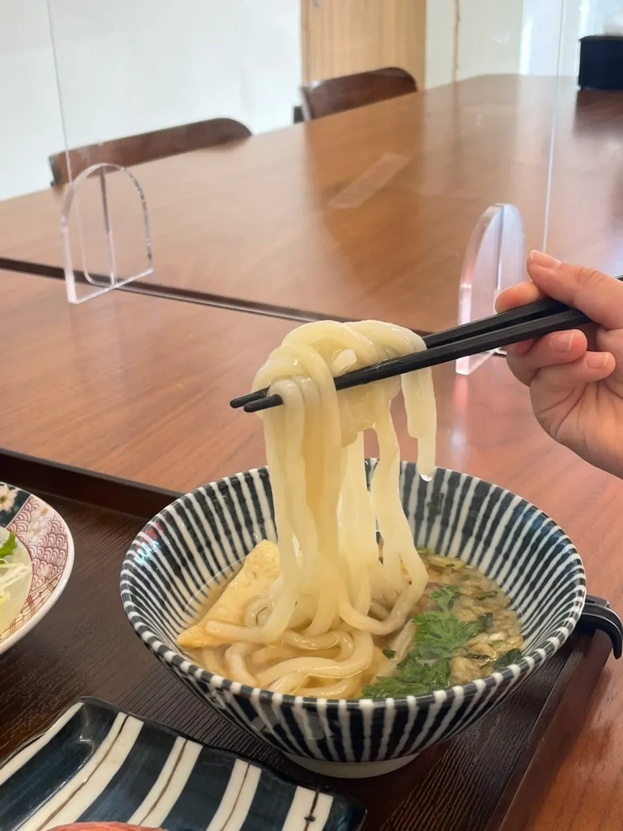 A bowl of warm udon chosen as the set noodle