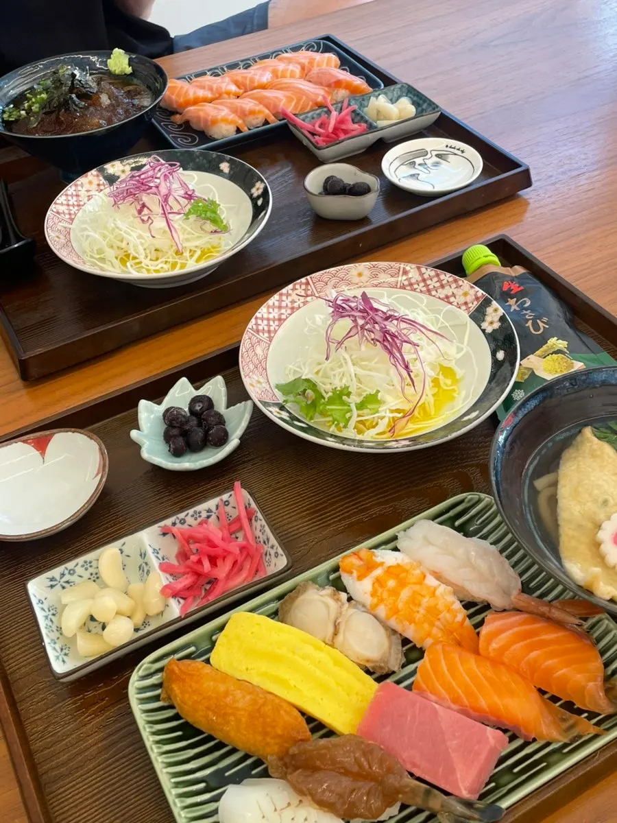 All three sushi sets laid out together on the table