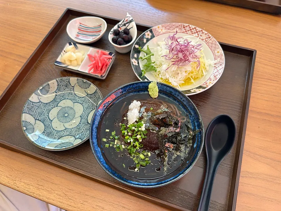 A spread with udon, soba, and salad served together