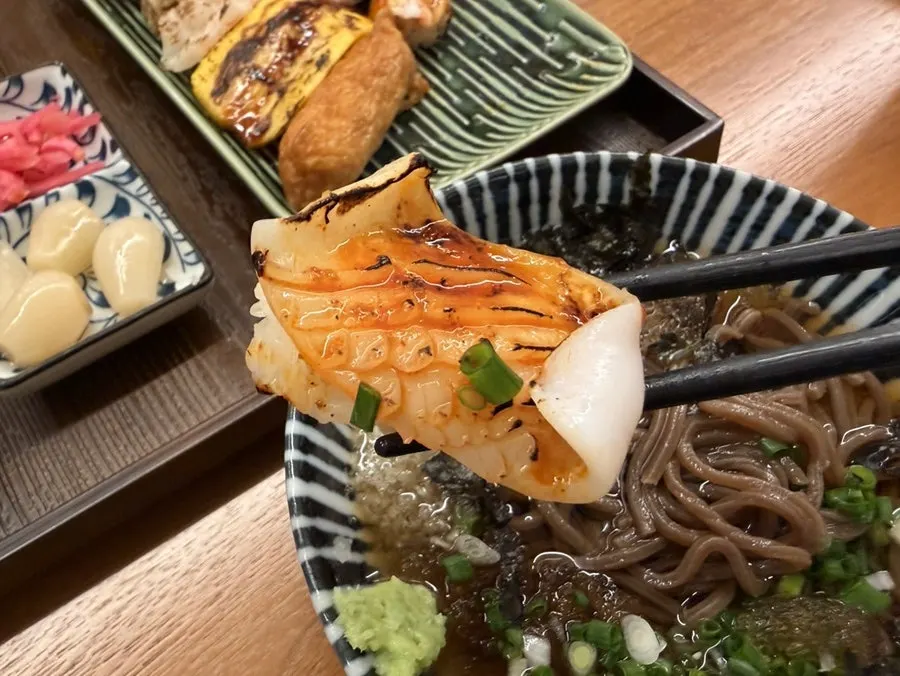 Close-up of flame-seared sushi with different toppings