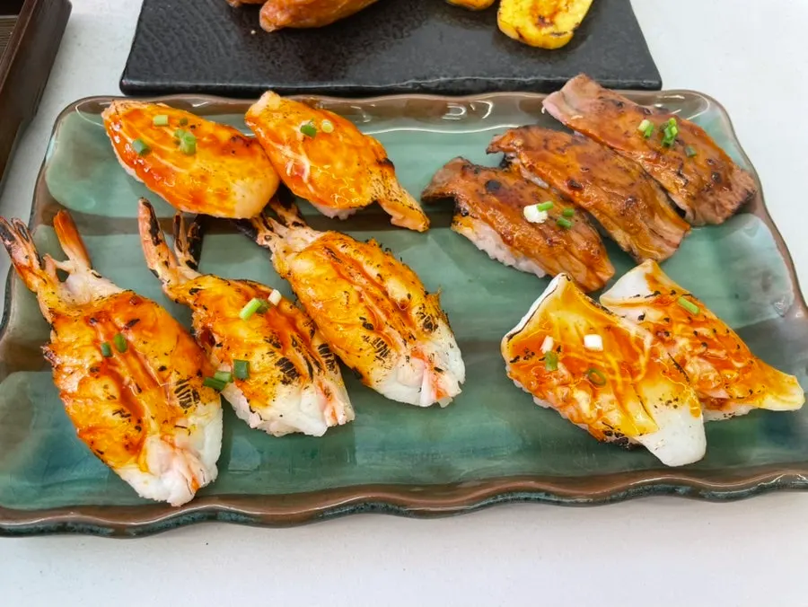 Full spread of the Sushi Hwa flame-seared sushi set on the table