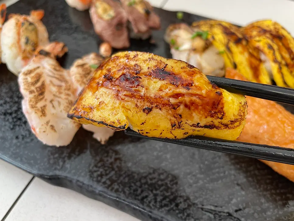 Close-up of Sushi Hwa's smoky flame-seared sushi