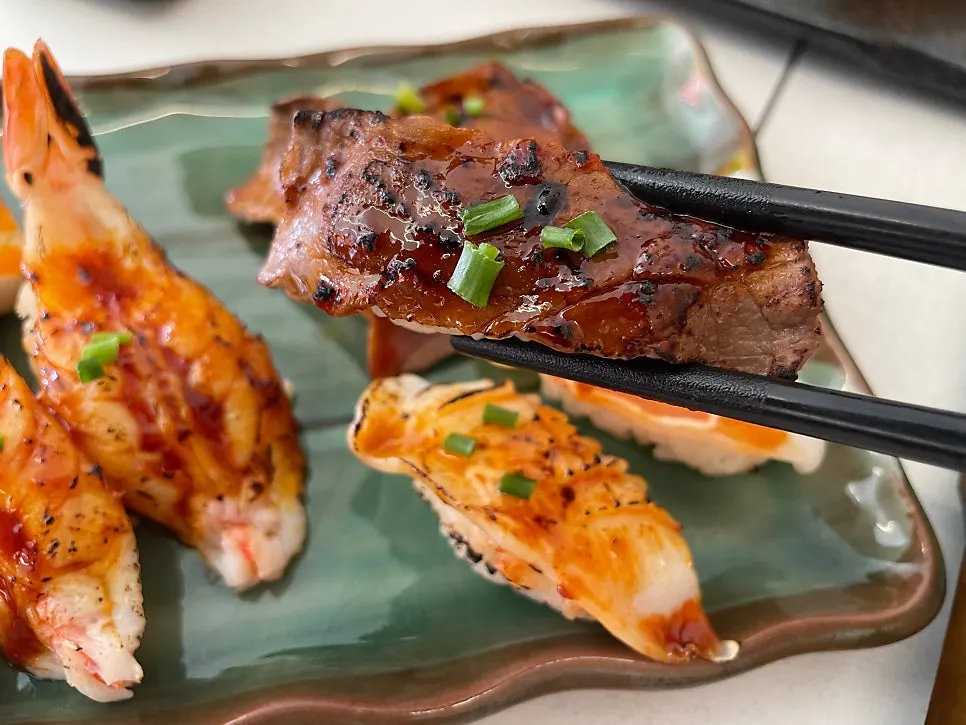 Assorted flame-seared sushi with seared toppings