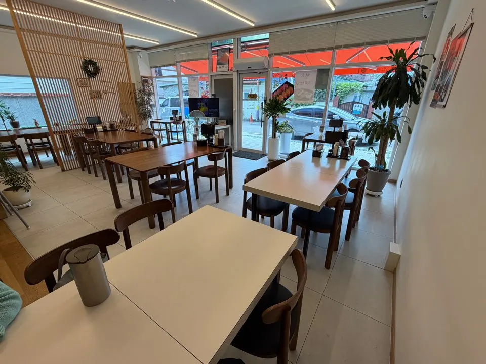 Full view of the Sushi Hwa building with a European café feel