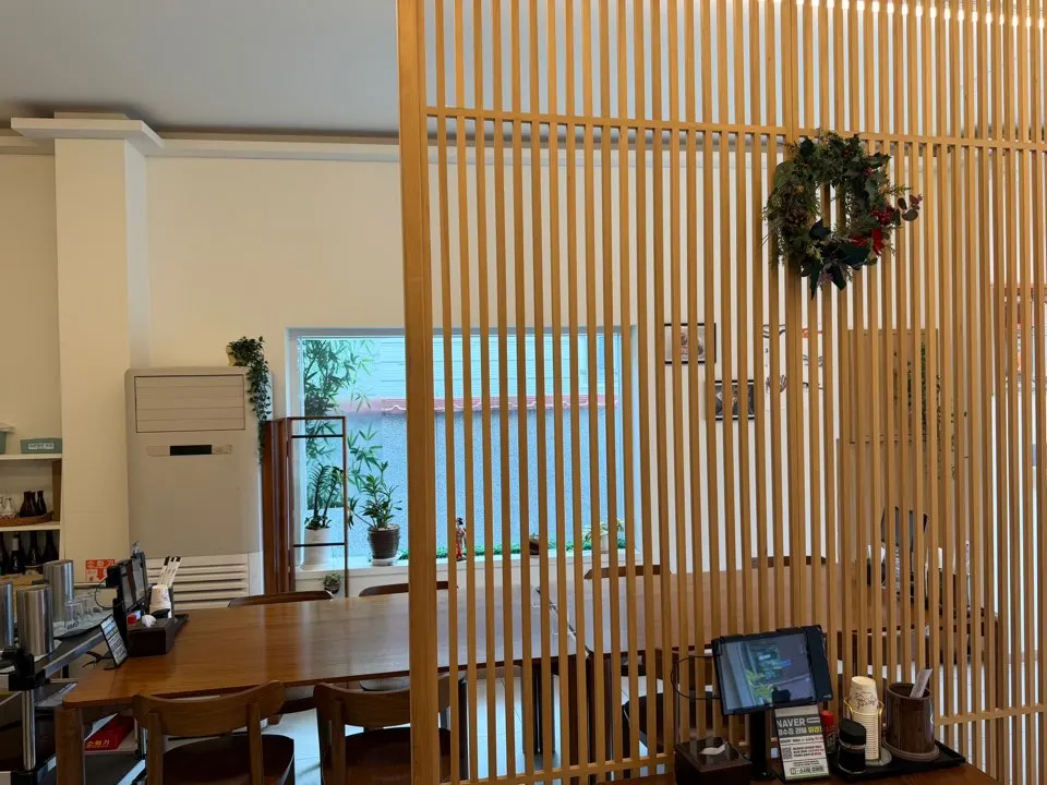 Interior of Sushi Hwa with wood-tone decor
