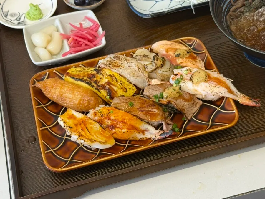10 pieces of flame-seared sushi with salmon, wagyu, and beef brisket