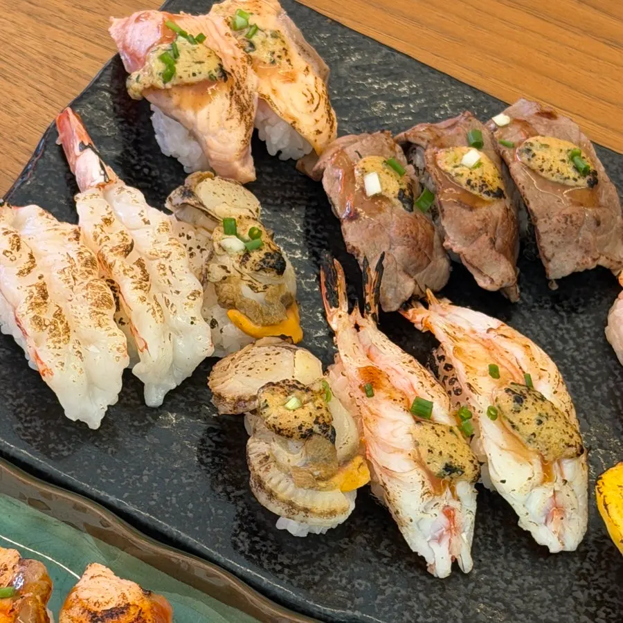 Flame sushi including inari sushi and egg sushi
