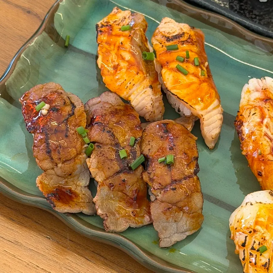 Spicy flame sushi served in a green bowl