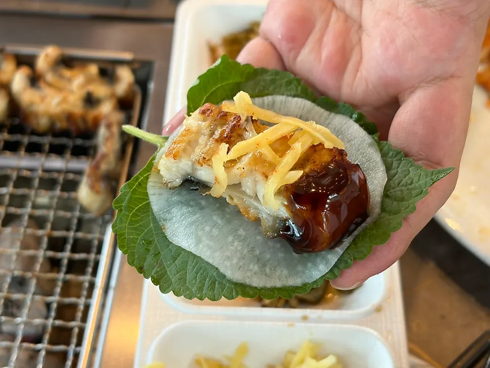 Remaining grilled eel and sides on the grill