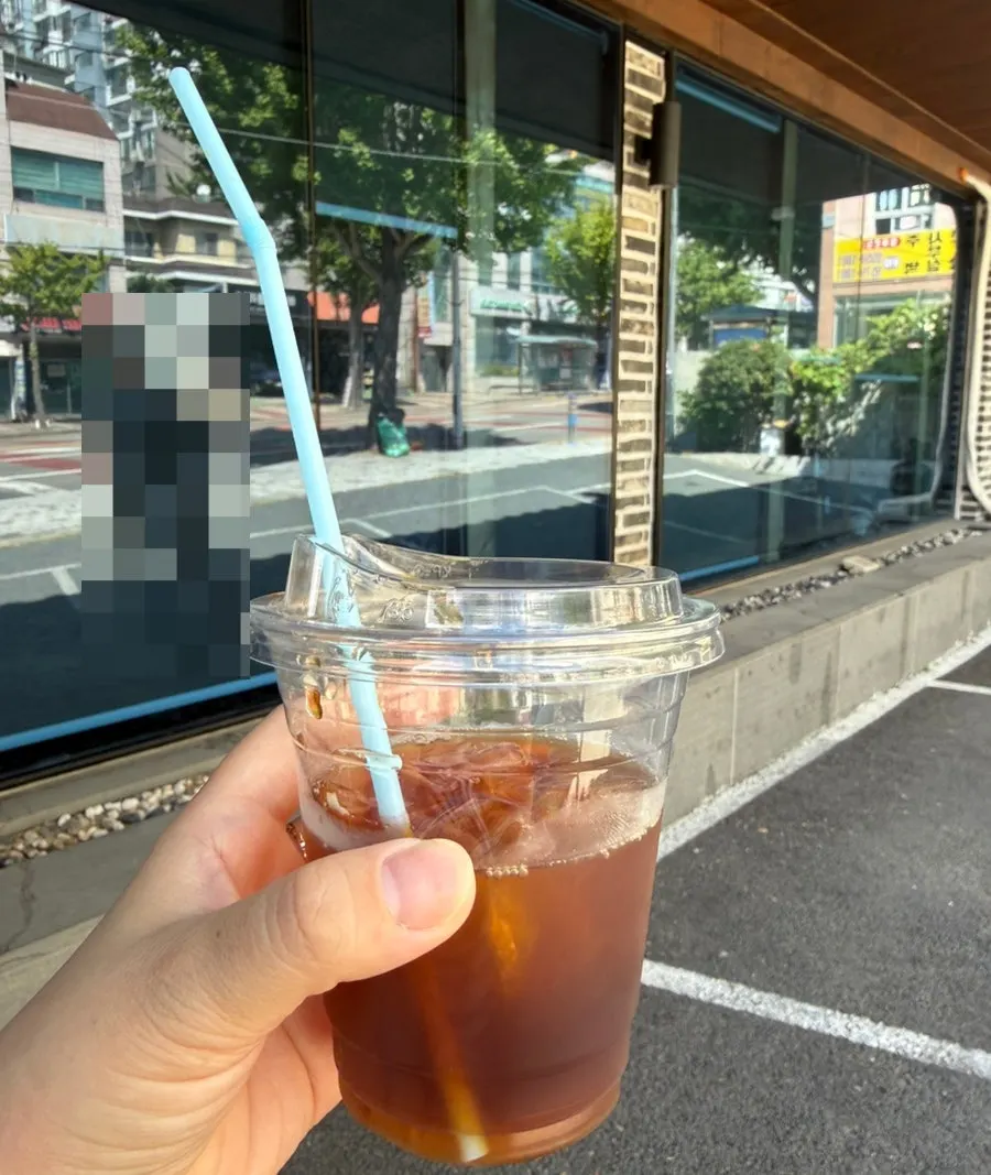 An iced Americano taken to go after the meal