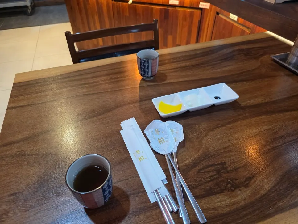 Jasmine tea and utensil place setting