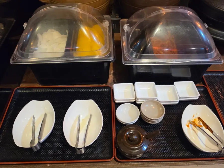 Self-serve bar with a water dispenser and jasmine tea