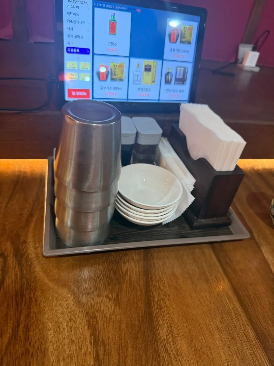 Table setting with soy sauce, vinegar, and wet wipes
