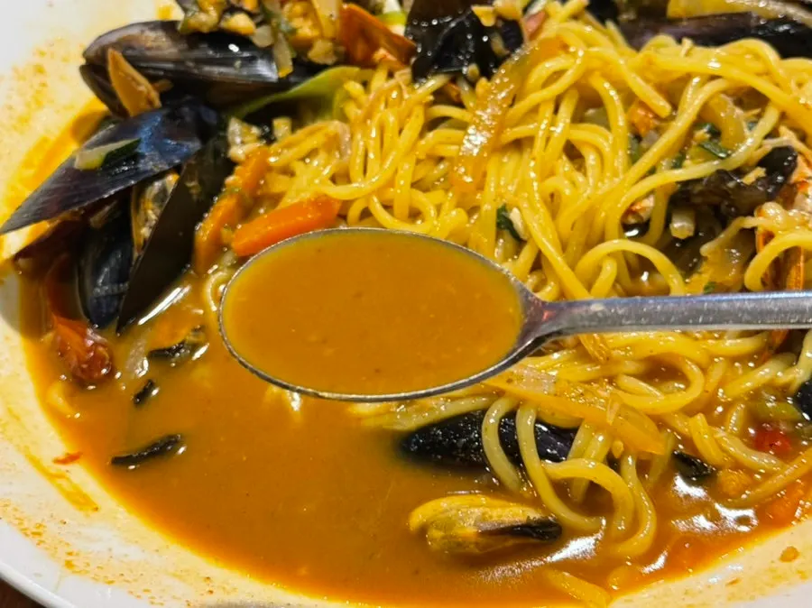 Handmade jjamppong noodles lifted up