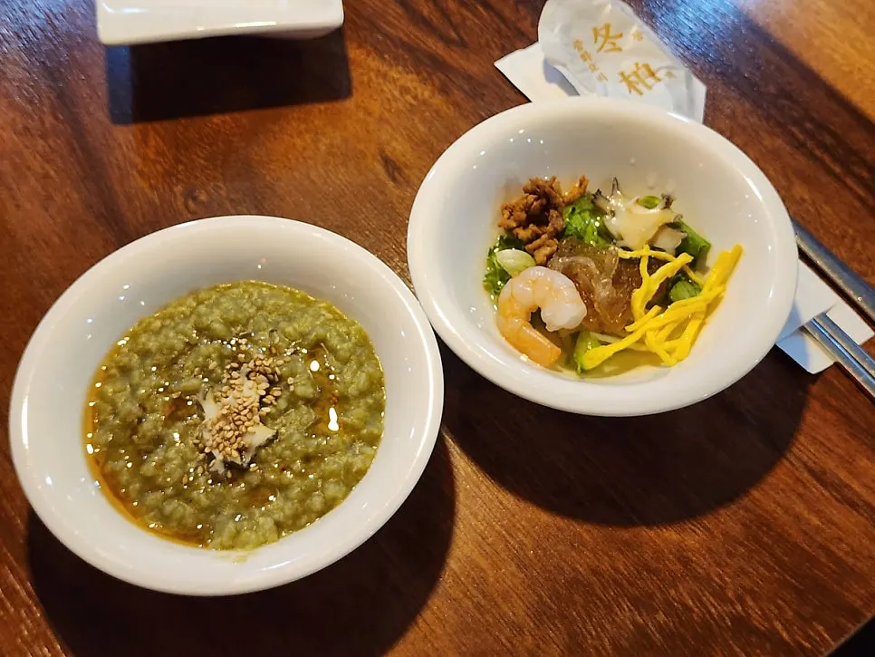 Abalone porridge and Dongbaek cold salad on the table
