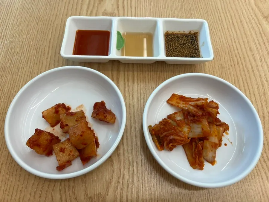 Table set with self-serve kimchi and the full spread