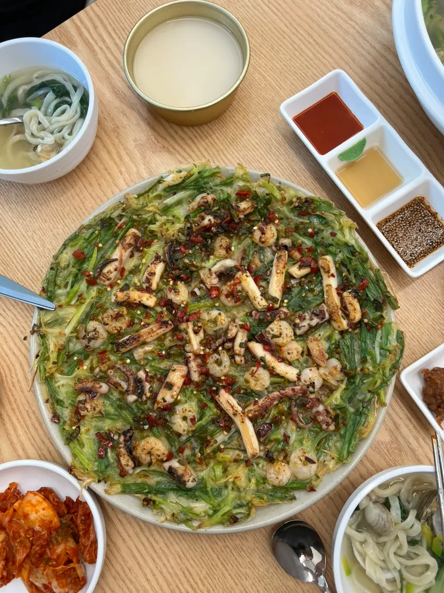 Onaksae seafood pancake topped with squid, octopus, and shrimp