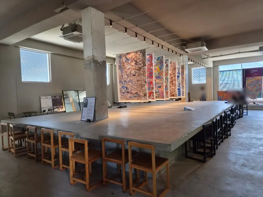 Exhibition space with a giant stone table