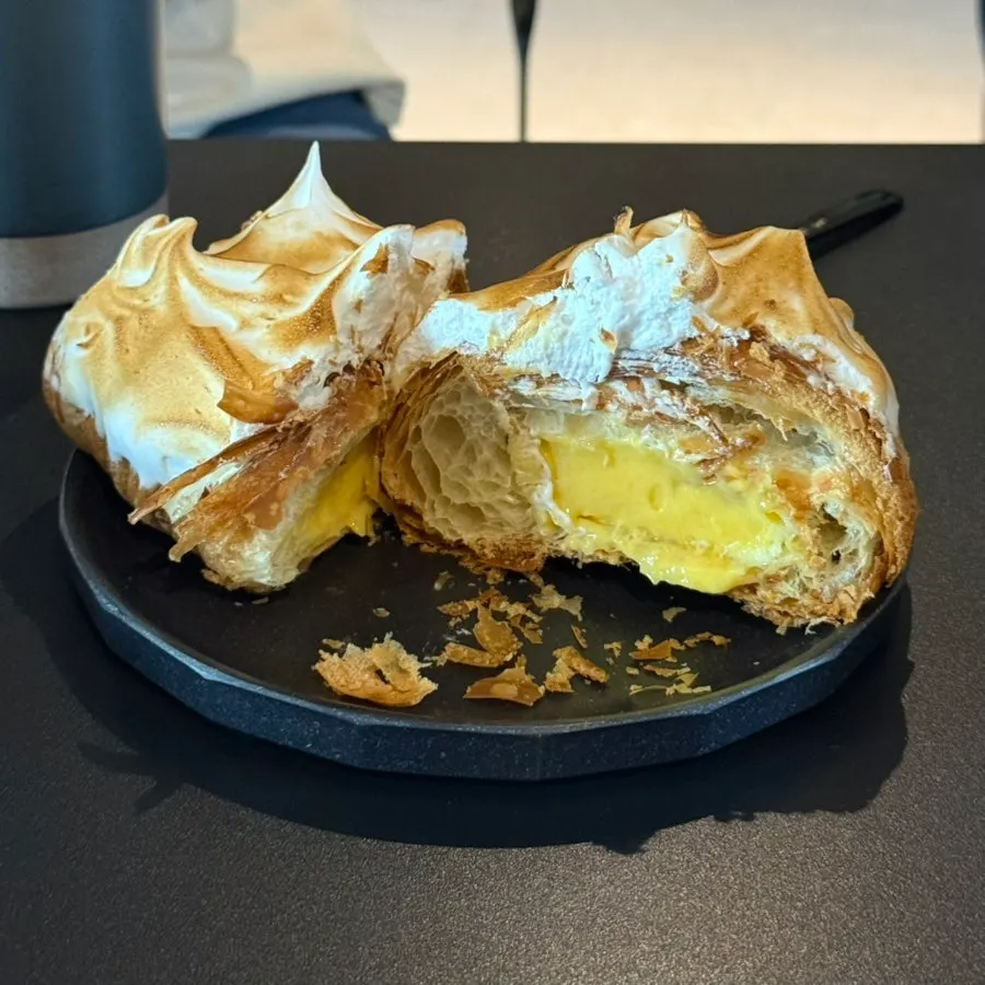 Lemon meringue croissant topped with torched meringue