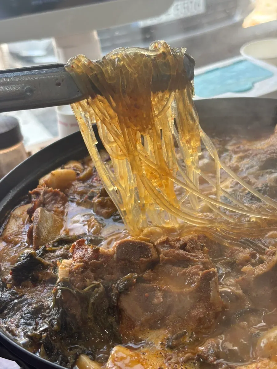 A spoonful of rice with rich gamjatang broth