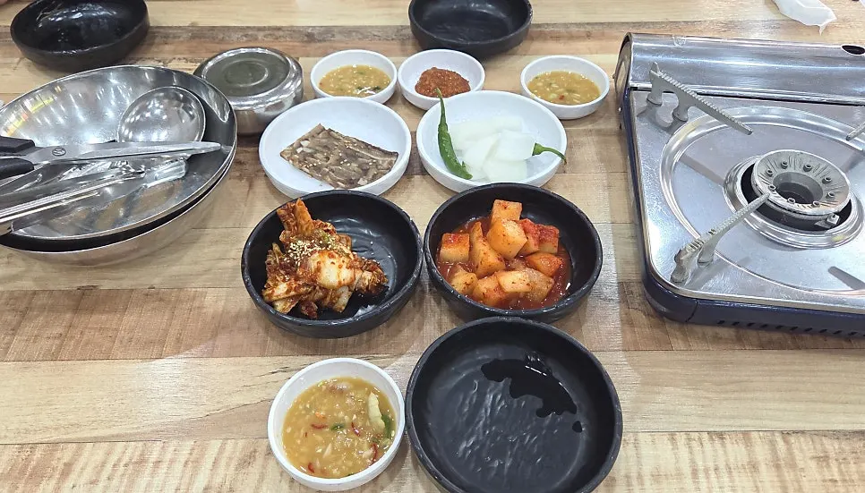Table set with basic side dishes and burner