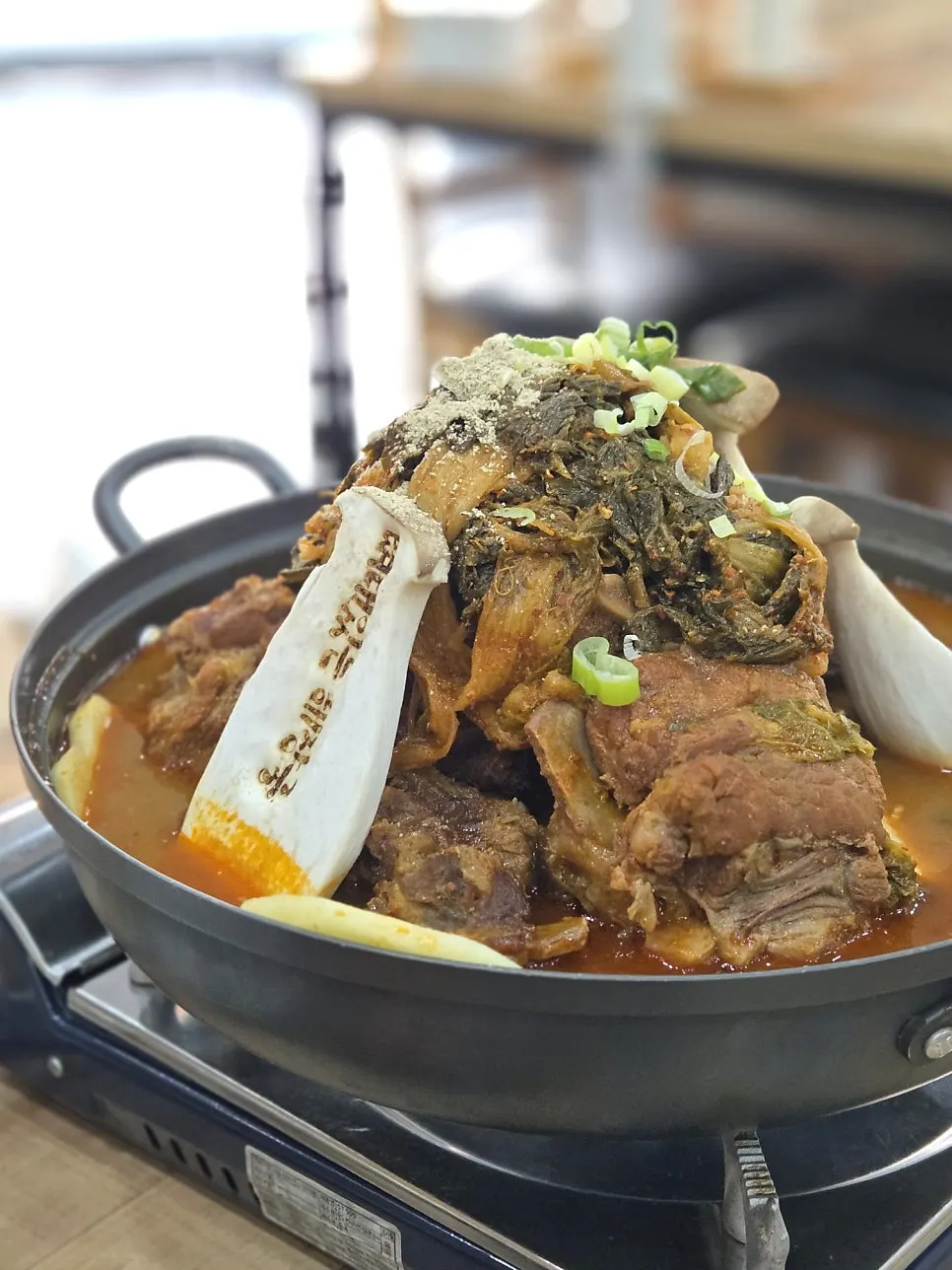 Close-up of the gamjatang piled high with meat