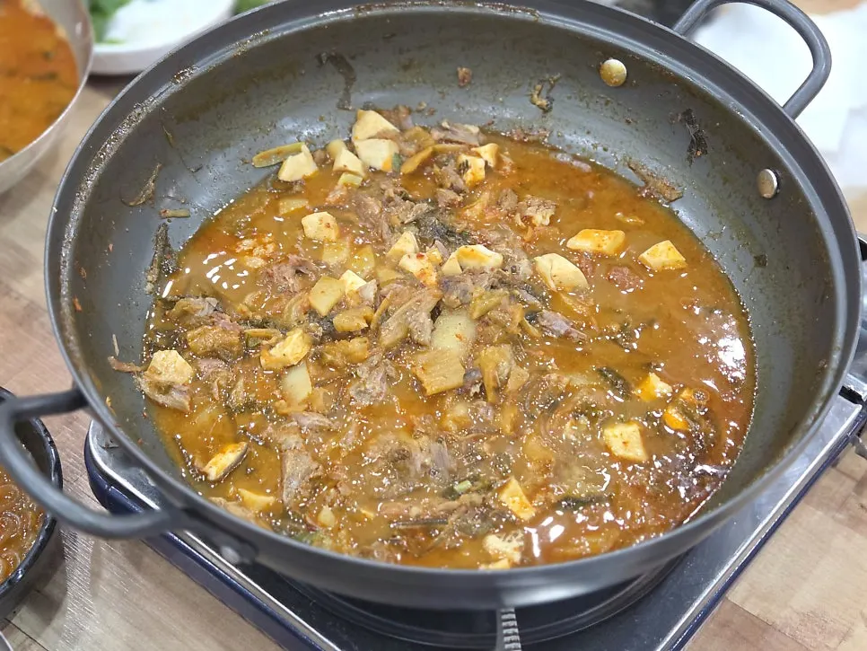 Pot with remaining broth and ingredients arranged