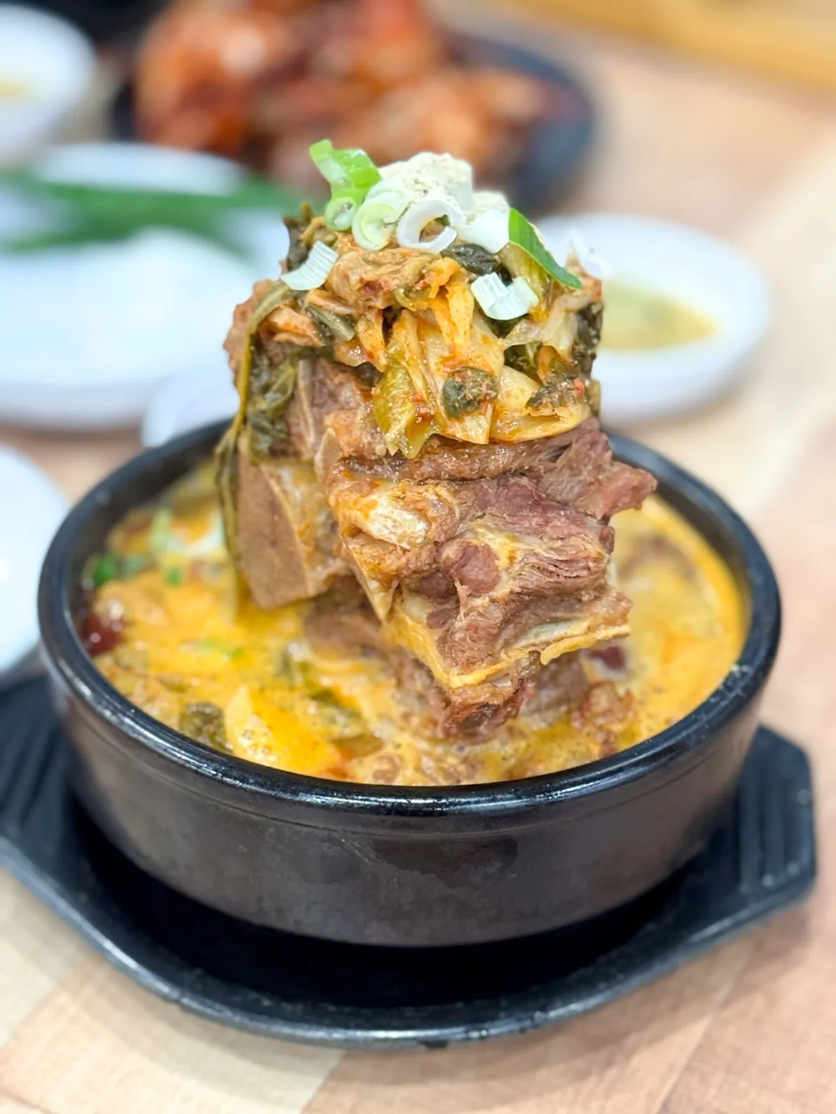 A full spread of pork bone haejangguk at Ppyeodae Itneun Haejangguk Juchon Branch